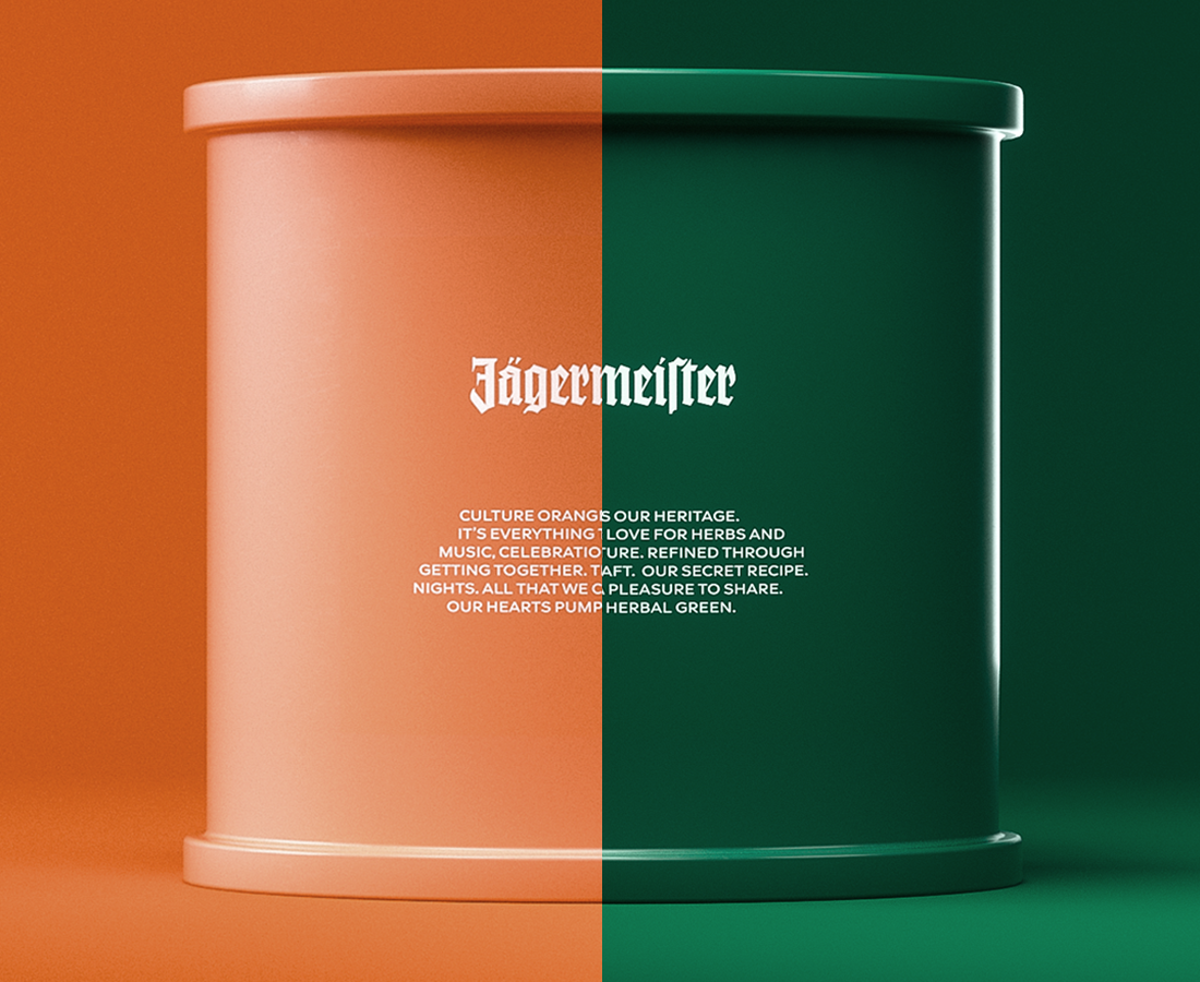 Jägermeister-branded cylindrical container displayed against a split orange and green background, with the design divided vertically between the two colors and featuring centered white logo and text.