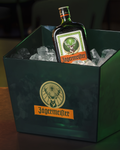 Jägermeister bottle in a green ice bucket with visible logo.