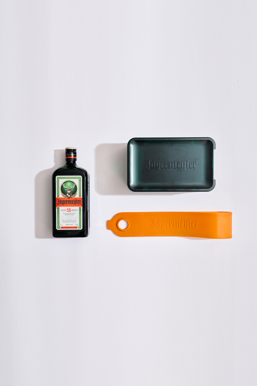 Bottle, green coldblock and orange strap on a white background