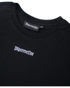 Zwarte cropped tee met Jägermeister-logo.