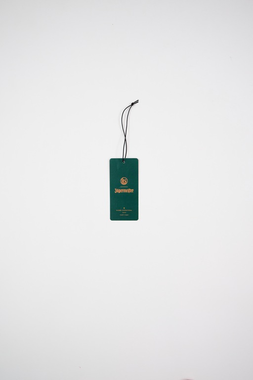 Green side of fragrance paper with brand logos on a white background