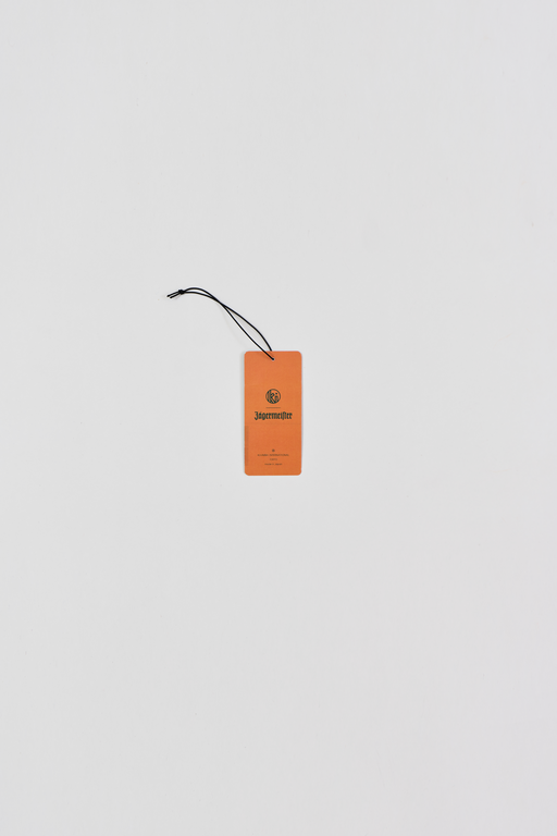 Orange side of fragrance paper with  brand logos on a white background