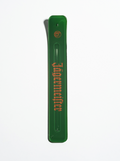 Green incense stick holder with orange 'Jägermeister' branding on a white background