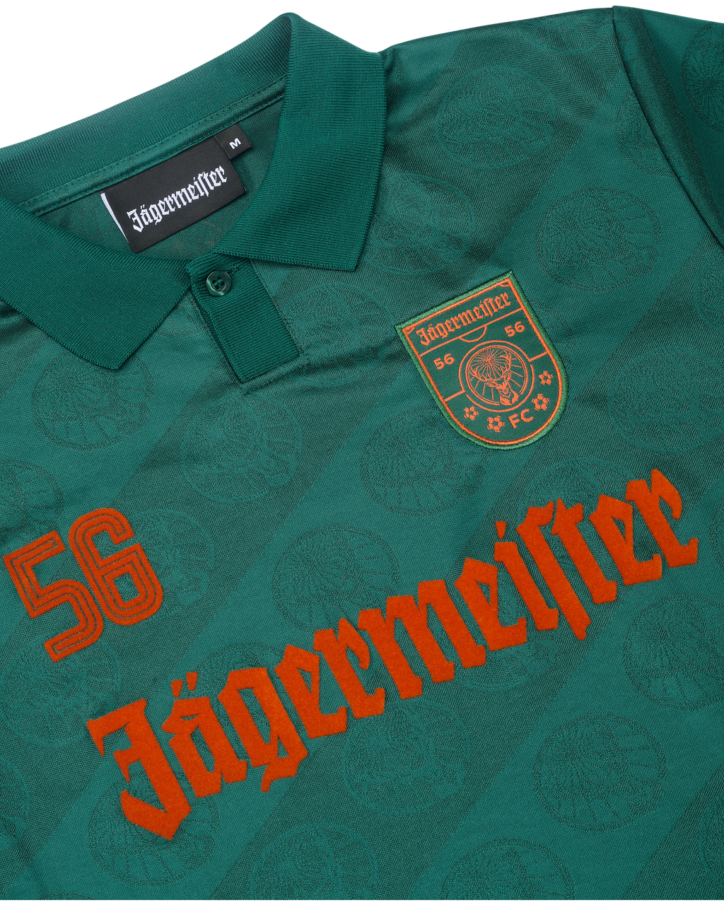 Close-up of a green jersey with Jägermeister branding.