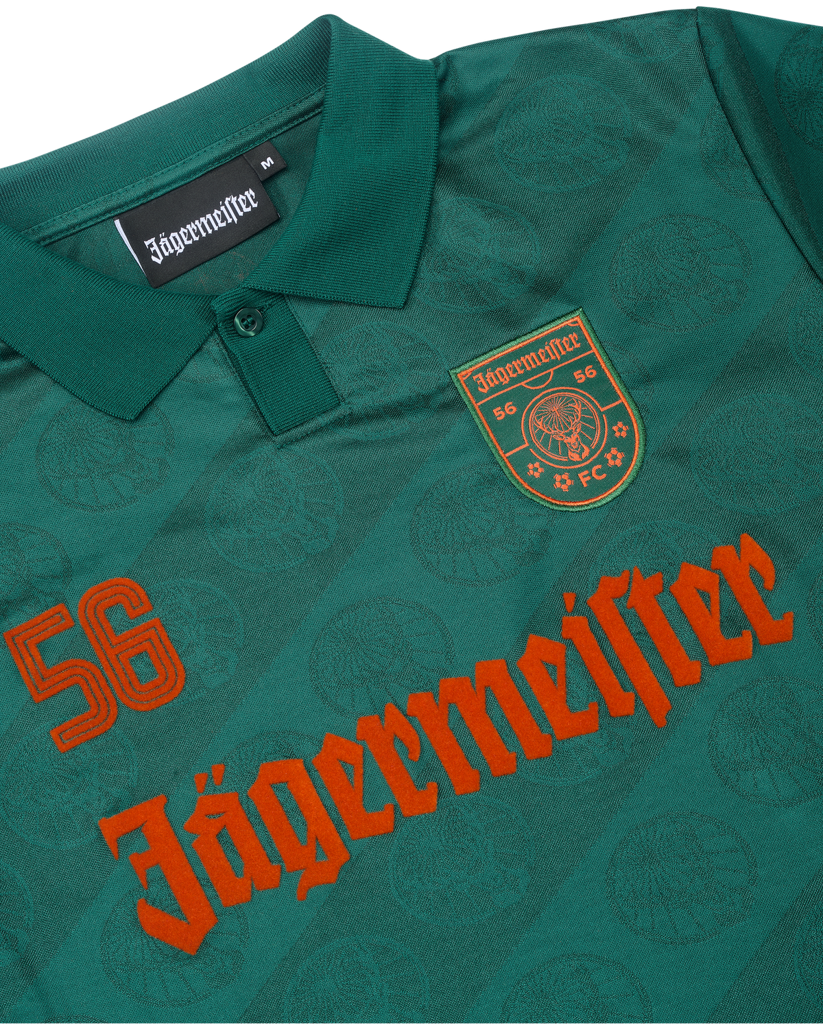 Close-up of a green jersey with Jägermeister branding.