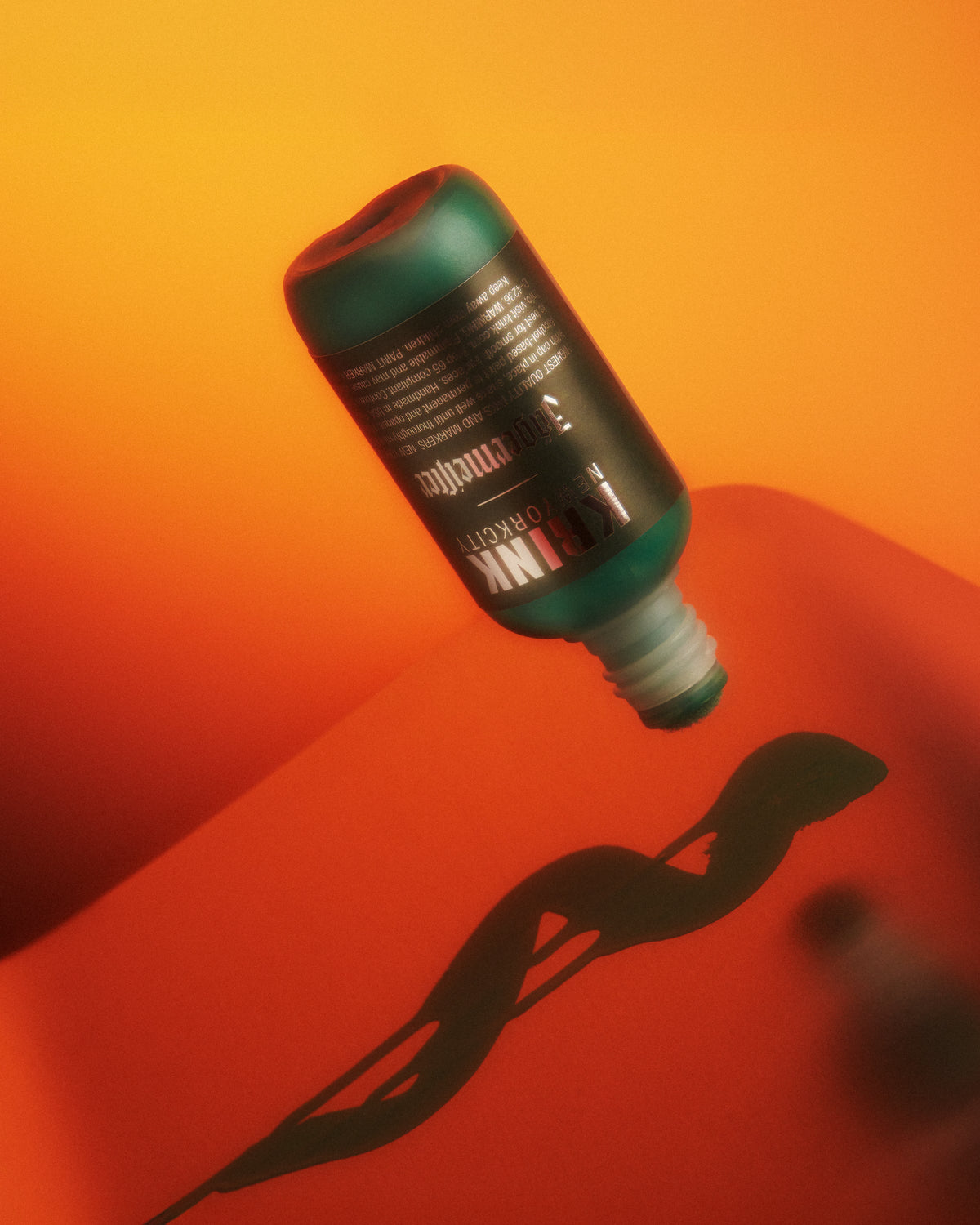 Green Krink marker with Jägermeister branding on a red and orange gradient background