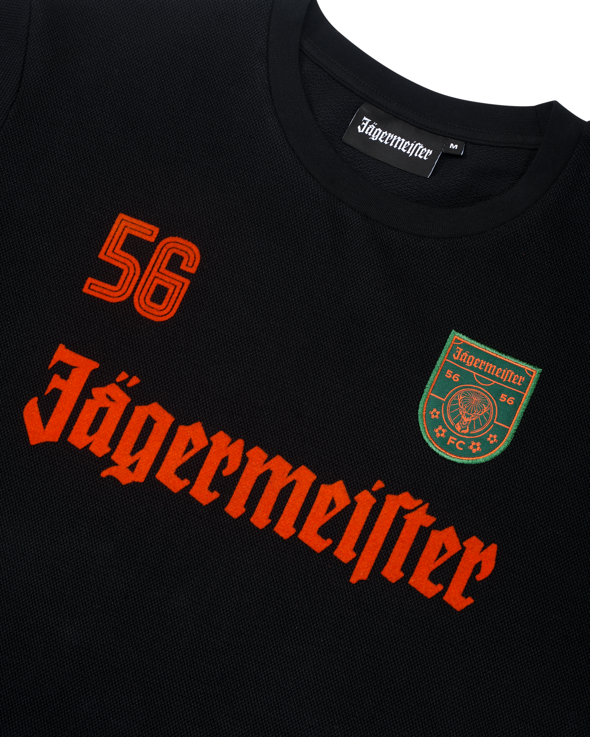 Black Jägermeister longsleeve with orange branding and logo.
