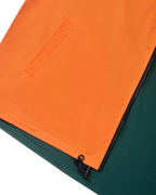 Close-up of an orange and green jacket with a zipper