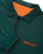 Close-up of the reversible Jägermeister jacket with a zipper showing the green side