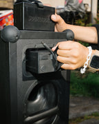 Black Soundboks speaker from the back showing battery