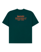 Green t-shirt with orange Jägermeister wordmark and address on the back.