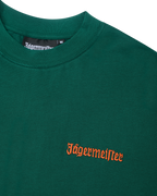 Green t-shirt with an orange Jägermeister wordmark on the chest.