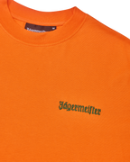 Orange t-shirt with green Jägermeister logo on the chest.