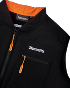 Black Jägermeister tactical vest with white Jägermeister wordmark branding and an orange zipper.