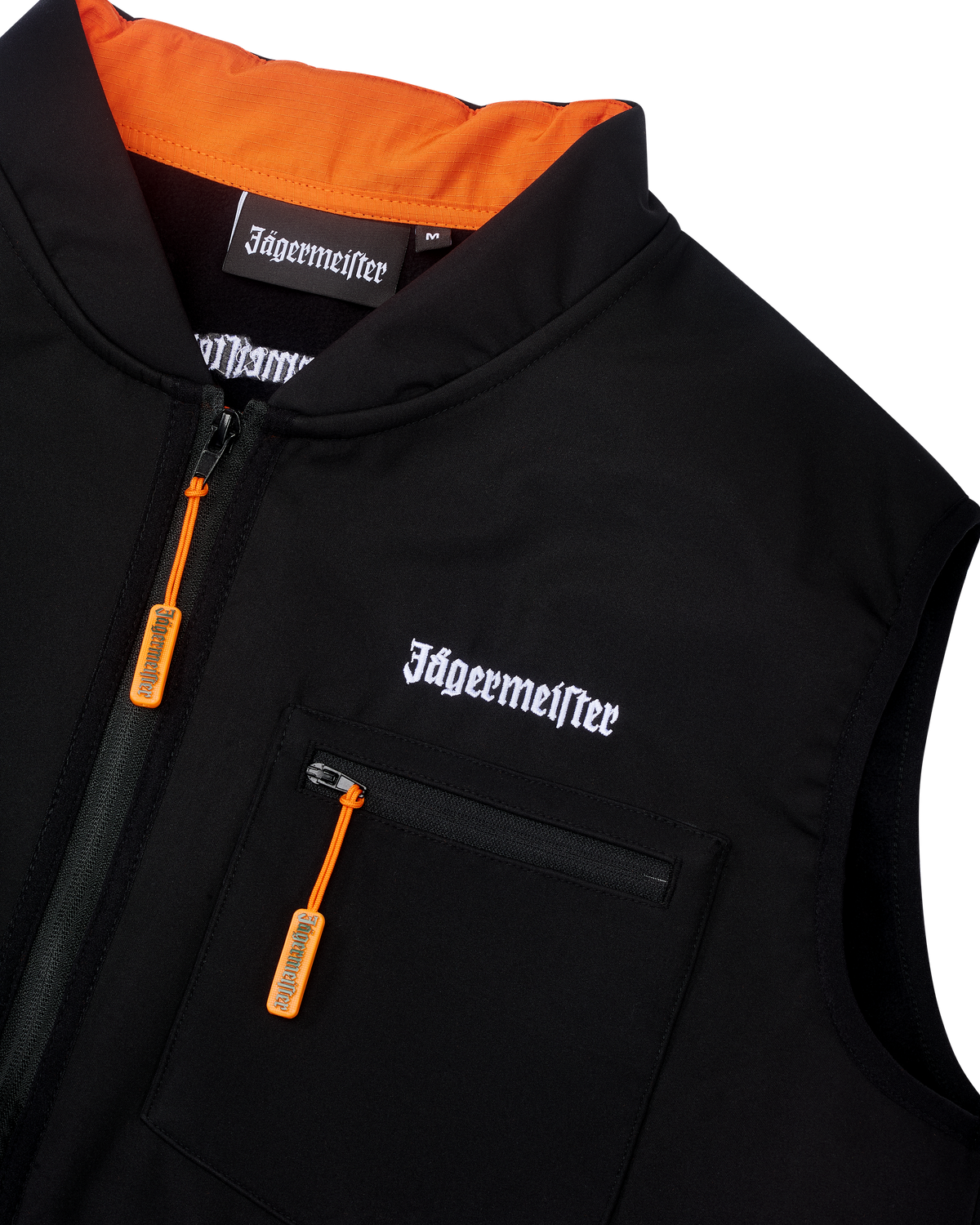 Black Jägermeister tactical vest with white Jägermeister wordmark branding and an orange zipper.