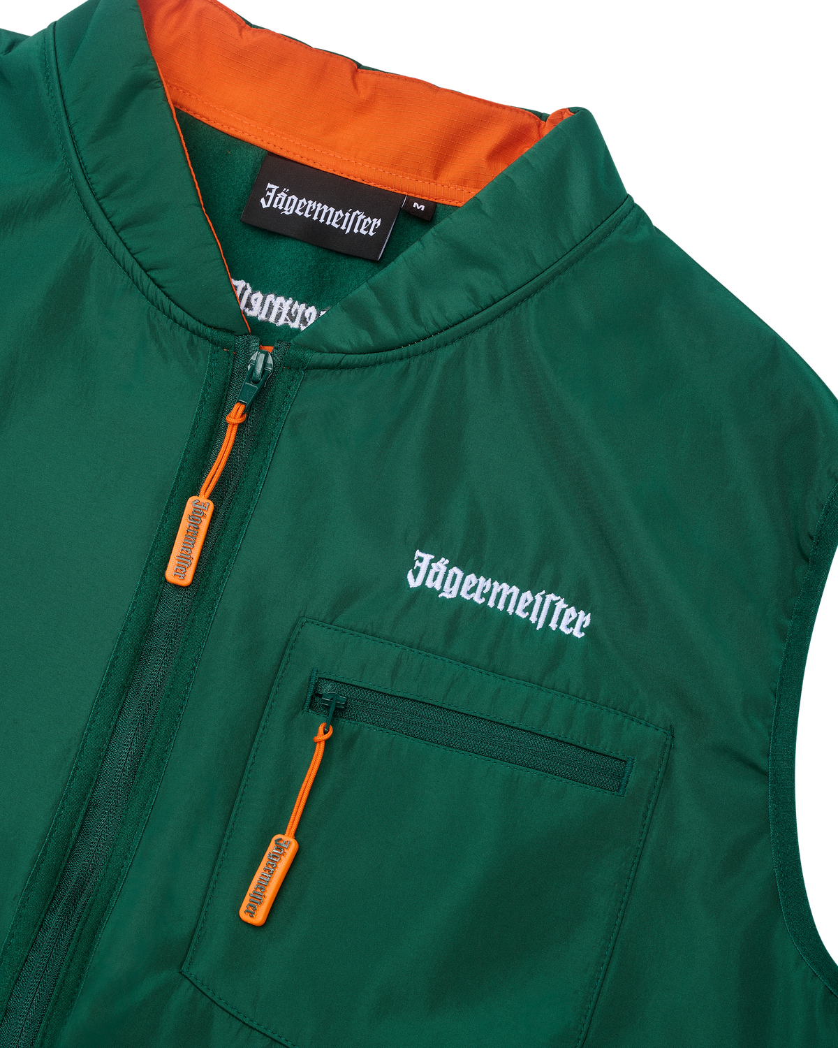 Green vest with orange interior and white Jägermeister branding.