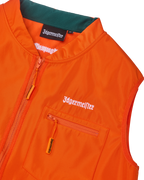 Close-up of an orange vest with white Jägermeister branding.
