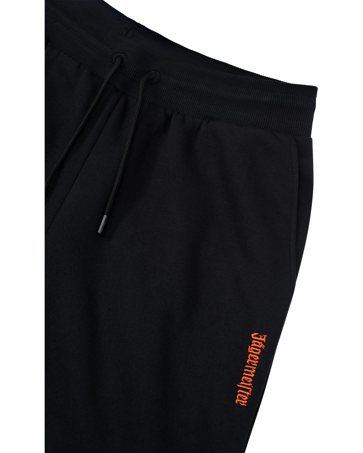 Black track pants with orange Jägermeister logo on the side.